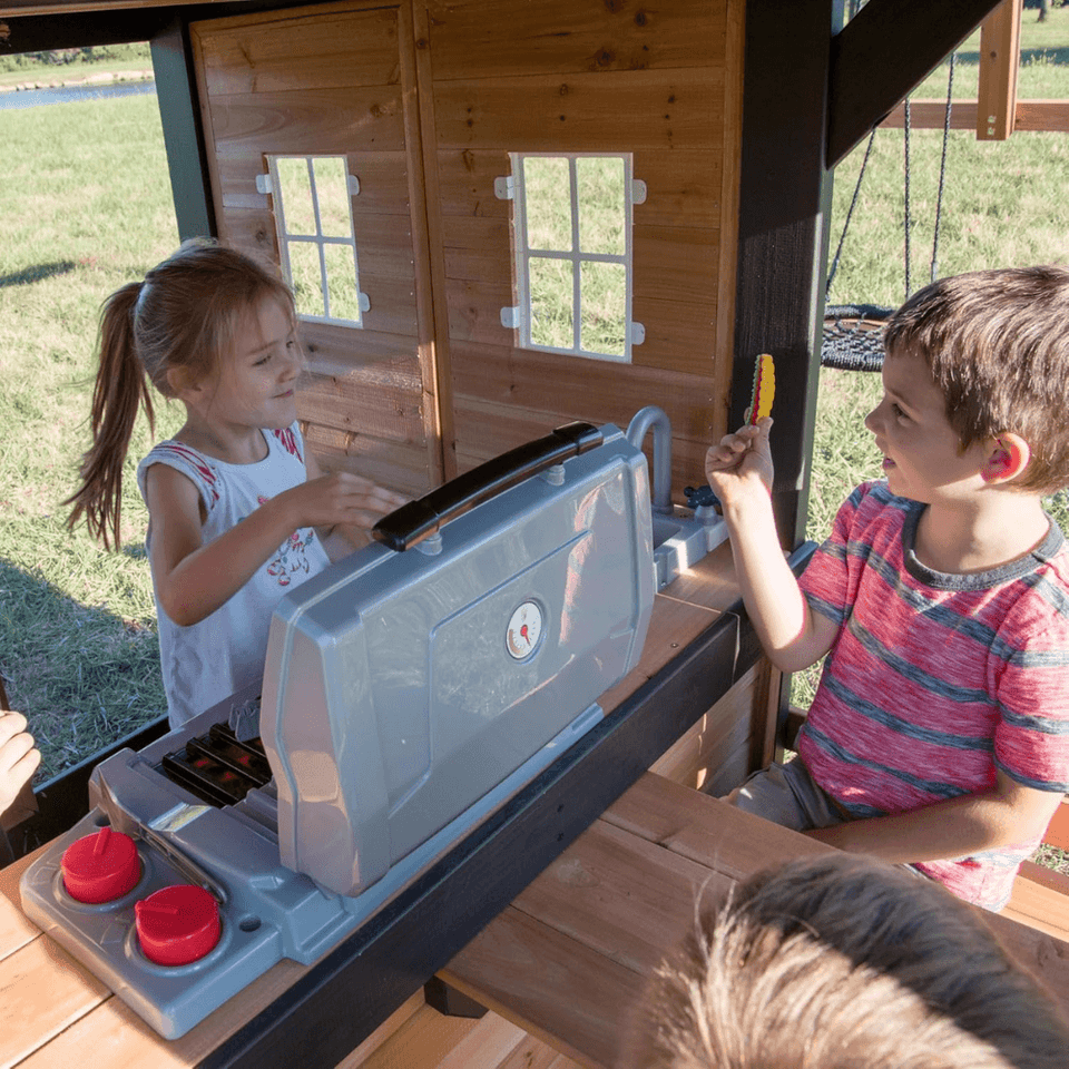 Canyon Creek All Cedar Swing Set Playset w/ Rockwall Upper Fort Belt Swings Web Swing Gray Wave Slide, and Play Kitchen